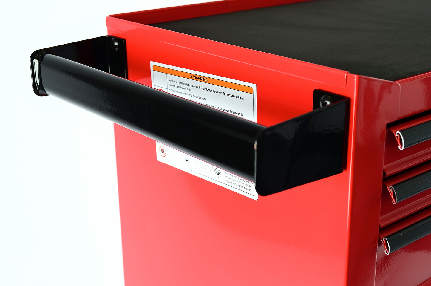 Red tool chest with black top and side handles on a white background