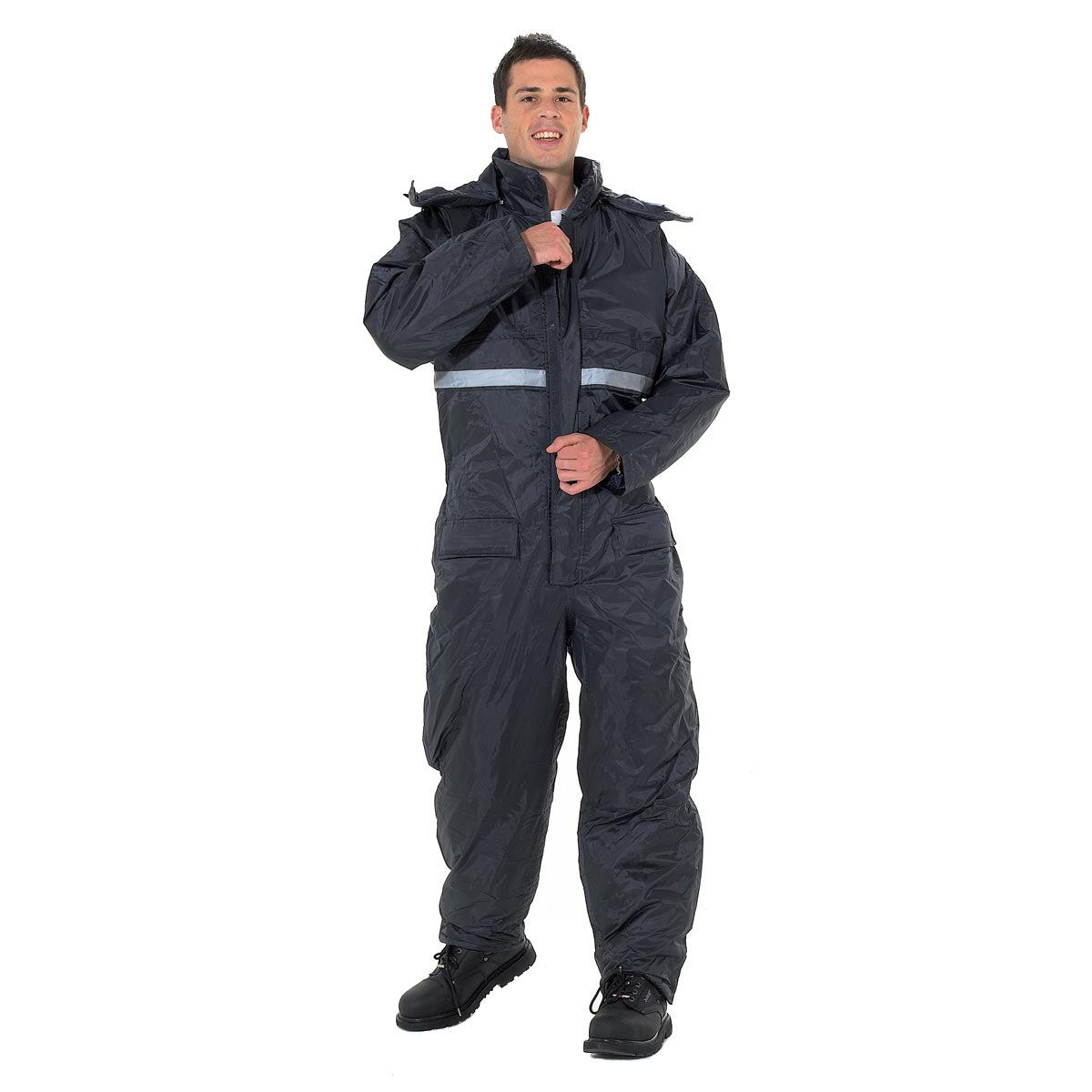 A person wearing a navy winter suit with a zipper and velcro closures, a hood, and reflective band around the chest.