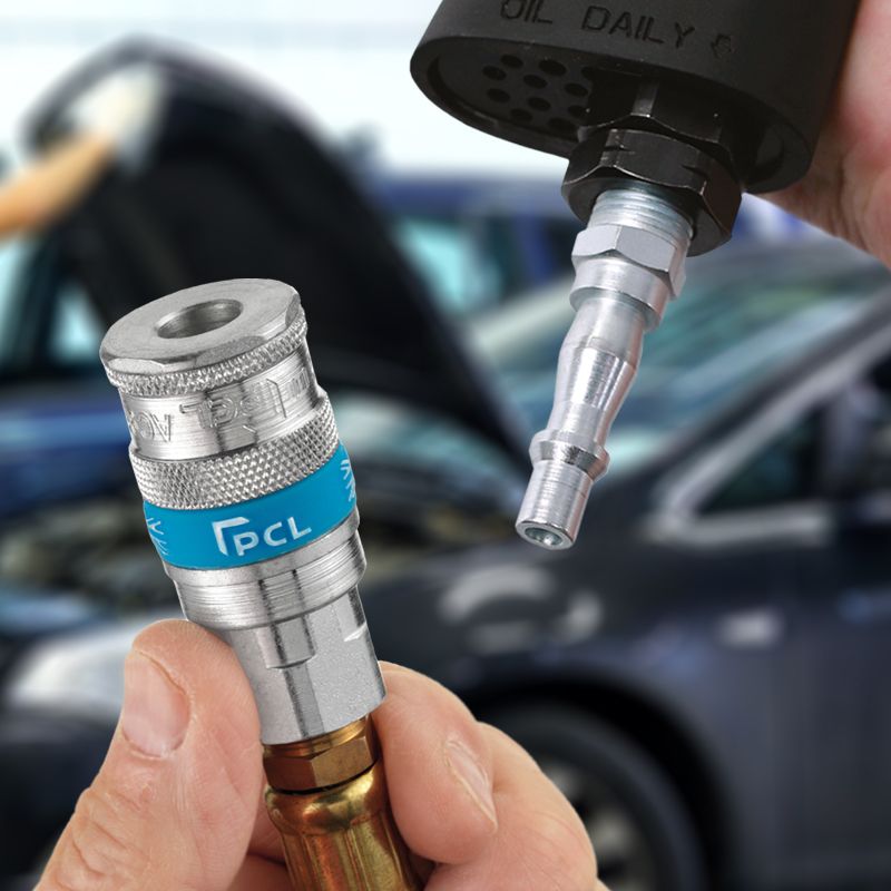 Close-up of a adaptor and a car in the background