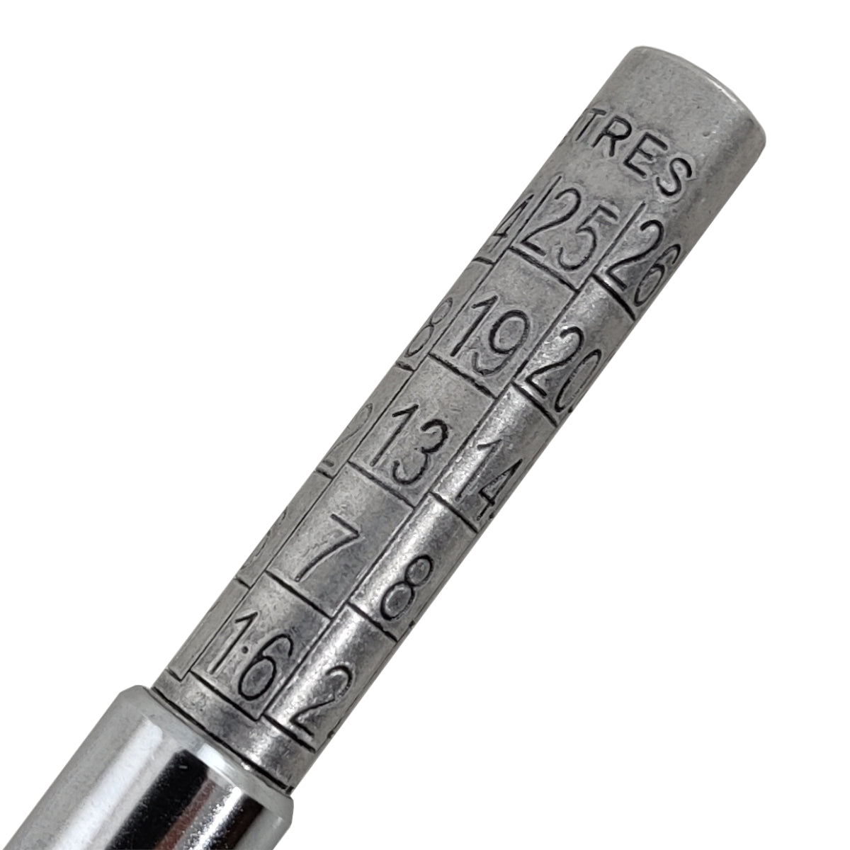 Metal tire pressure gauge with numerical markings on a white background