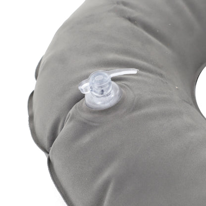 Gray inflatable pillow with a clear valve on a white background