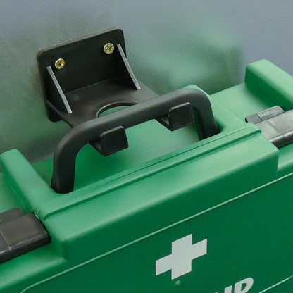Green first aid kit with a white cross symbol on a gray background