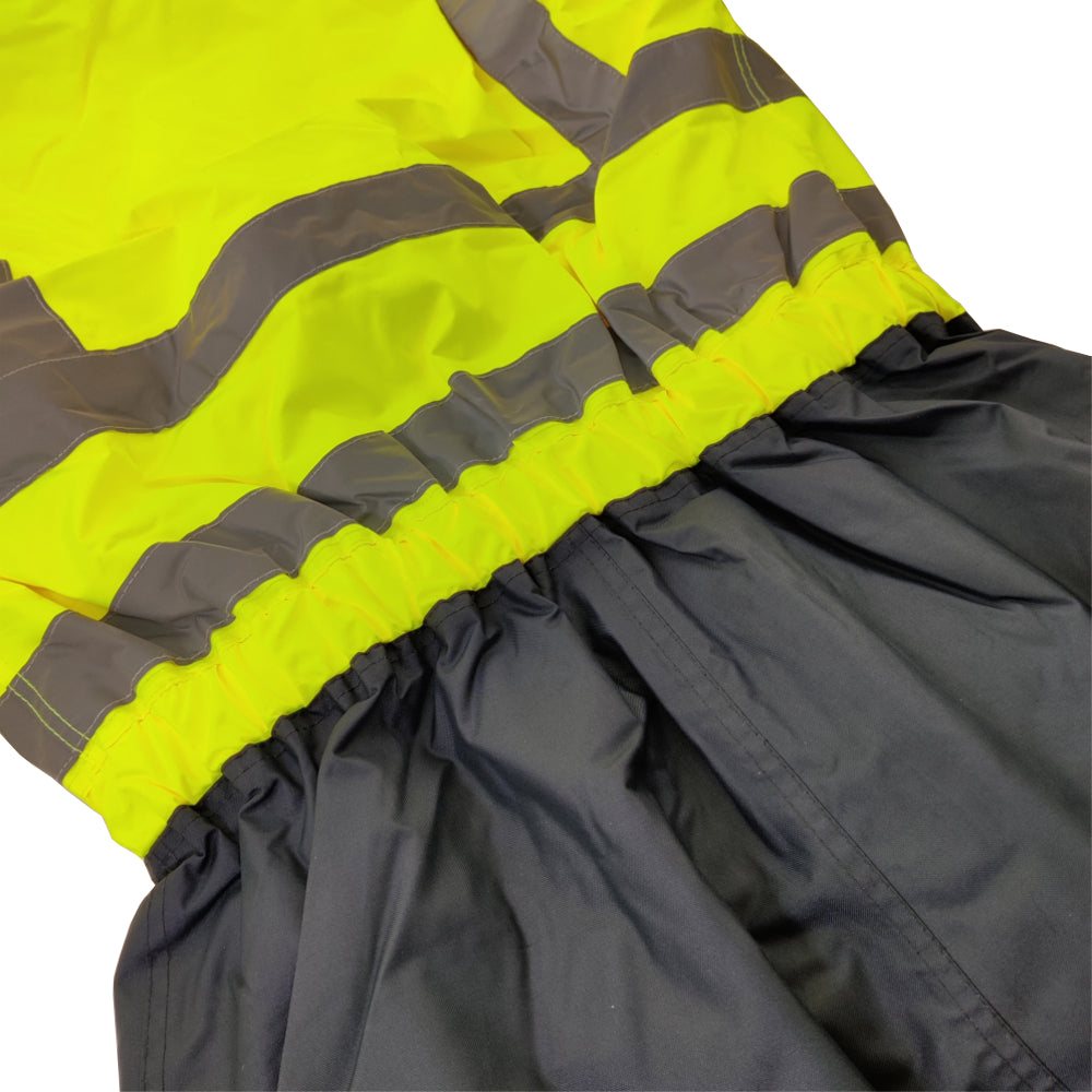 Close-up of a gray raincoat with reflective yellow and black stripes on a white background