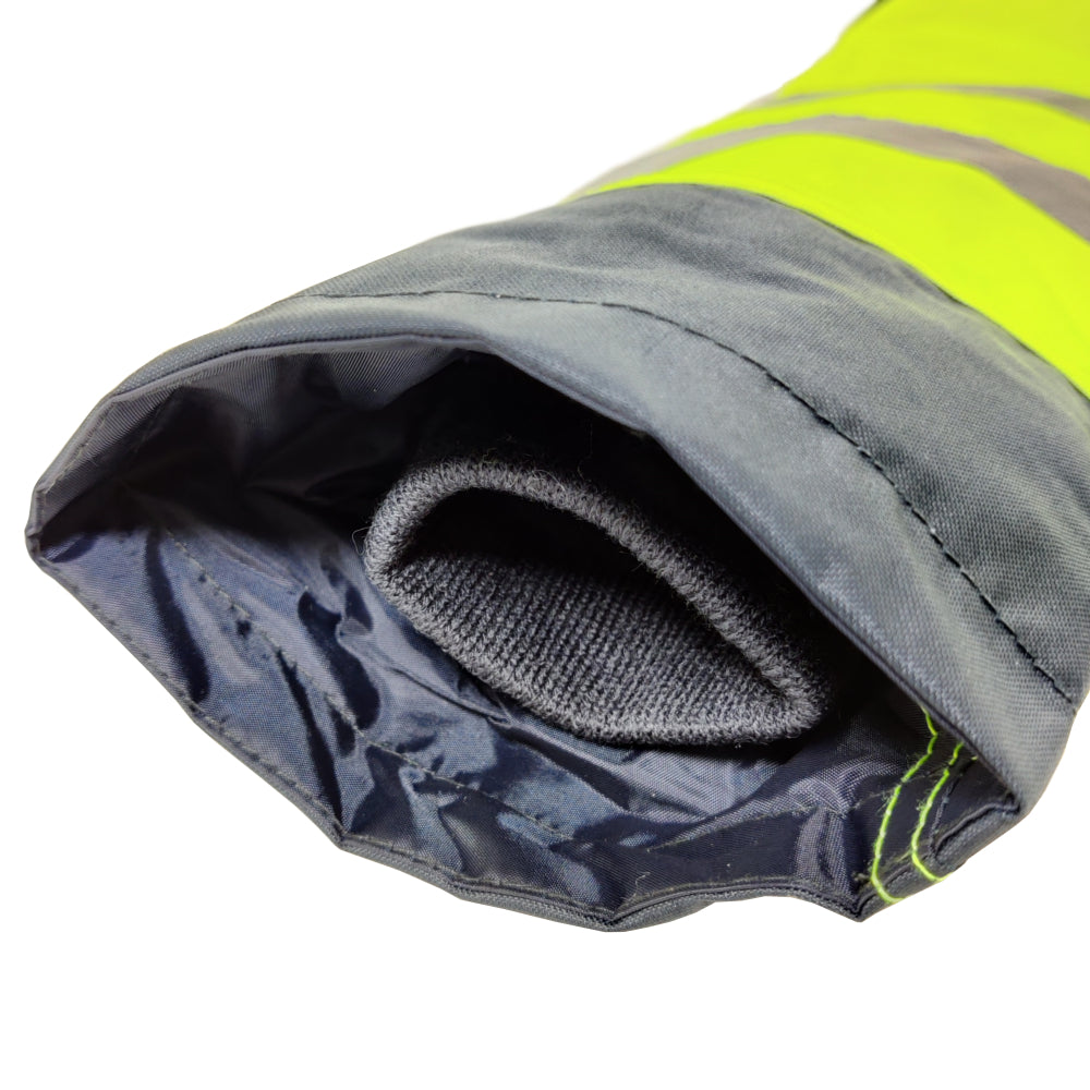 Close-up of a gray and yellow reflective safety jacket sleeve on a white background