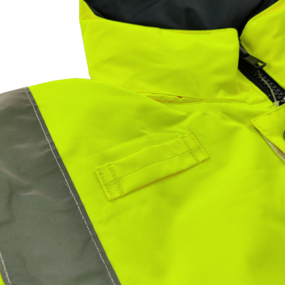 Close-up of a high-visibility jacket with a brand label on a white background