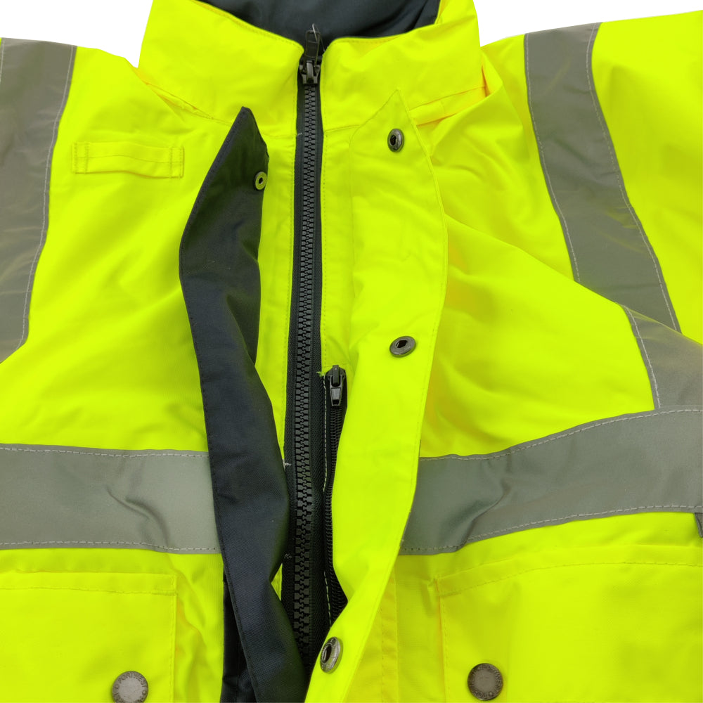 Close-up of a bright yellow safety jacket with reflective stripes.