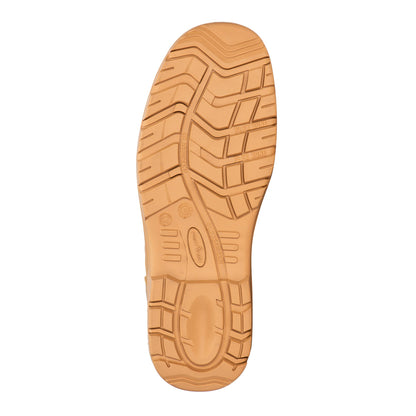 Tan shoe sole with tread pattern on a white background