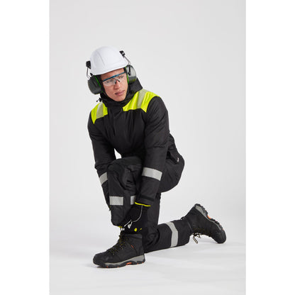 Person wearing a black safety suit with reflective elements, white helmet, and goggles on a light gray background